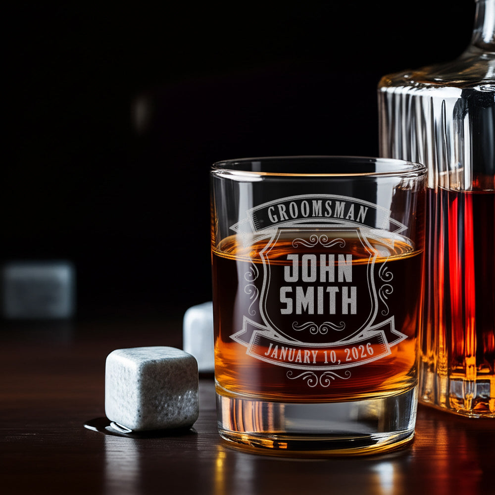 Personalized whiskey glass with engraved text on a wooden surface