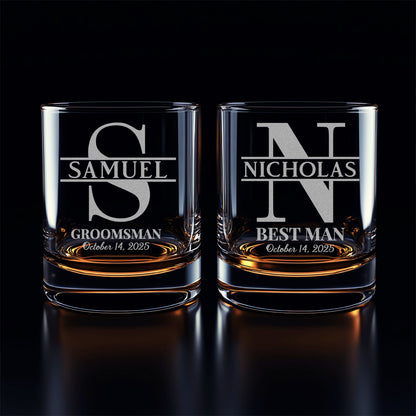 Two personalized glass tumblers with engraved names on a black background